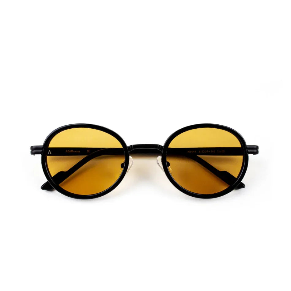Adam Young Eyewear siyah yuvarlak güneş gözlüğü sarı tonlu lensler ile
