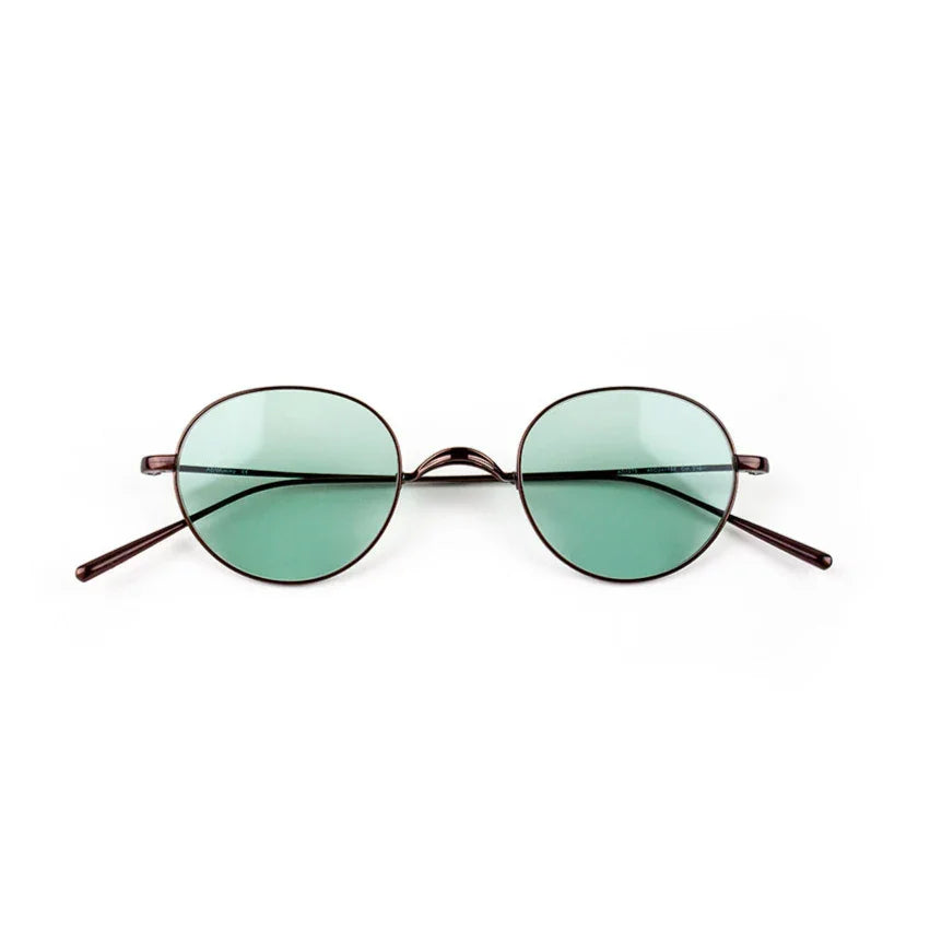 Adam Young Eyewear markasına ait hafif metal çerçeveli yeşil camlı yuvarlak güneş gözlüğü